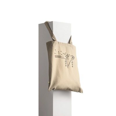 Natural canvas tote bag with long handles and front graphic print