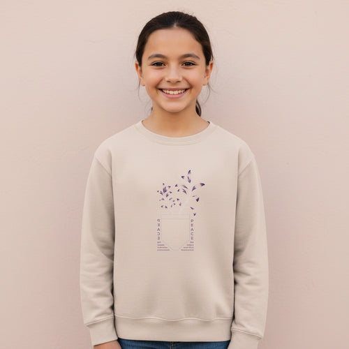 Kids cream sweatshirt with peace-themed graphic on front