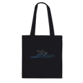 Black canvas tote bag with long handles and sailboat over wave graphic