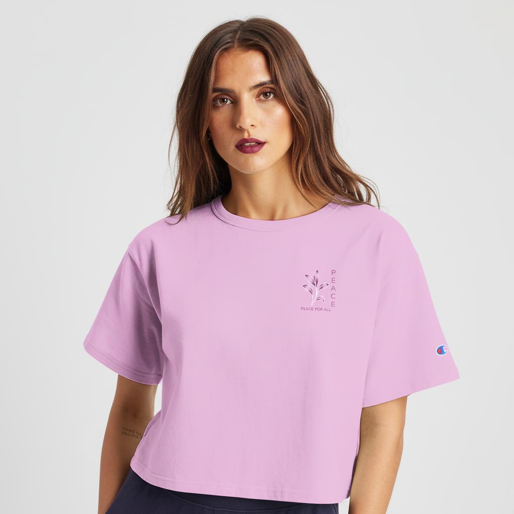 Women’s cropped heritage t-shirt in pastel pink, chest graphic and sleeve Champion logo