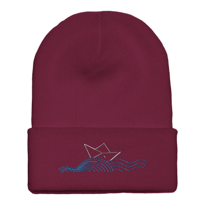 Cuffed beanie with boat and waves logo, maroon knit front.