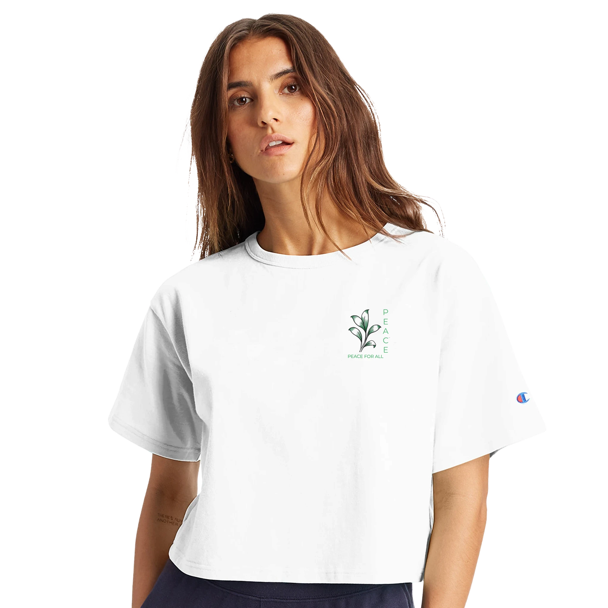 Women’s cropped heritage t-shirt in white, small chest graphic and sleeve Champion logo