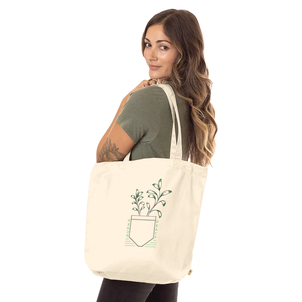 Cream tote bag with long handles and front potted tree with PEACE text graphic