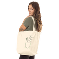 Cream tote bag with long handles and front potted tree with PEACE text graphic