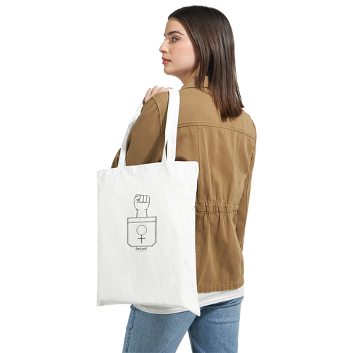 White canvas tote bag with wide handles and fist-and-circle graphic emblem