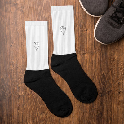 Feminist crew socks, white with black toe and heel, embroidered icon