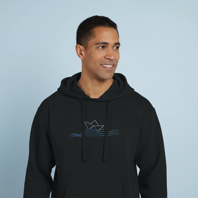 Black unisex pullover hoodie with front boat graphic and drawstrings