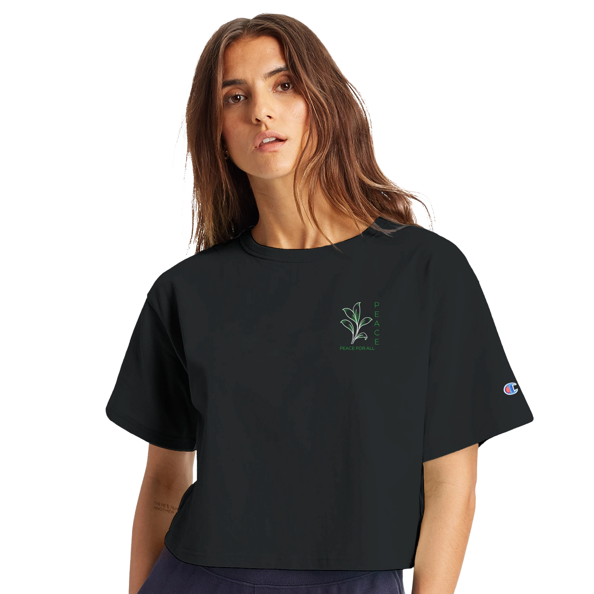 Women’s cropped heritage t-shirt in black, small chest graphic and sleeve Champion logo
